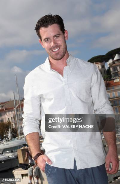 Australian reality television cook Brent Owens poses during a photocall for the TV serie "Brent Owens : Extreme, authentic and unwrapped" as part of...