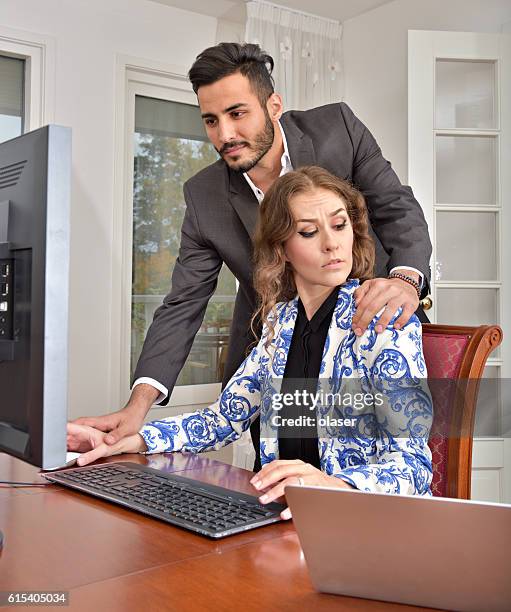 harrassed woman dislikes his hand. she wears ring. - colleague engagement stock pictures, royalty-free photos & images