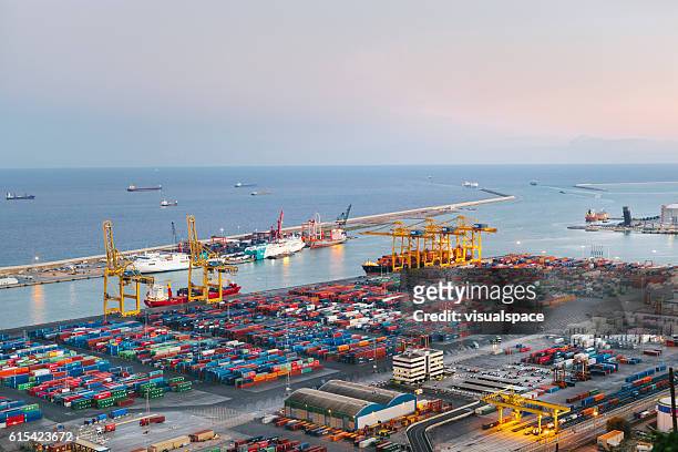 commercial dock with containers and cranes - seascape stockfoto's en -beelden