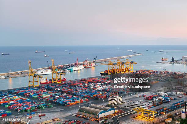 commercial dock with containers and cranes - porto imagens e fotografias de stock