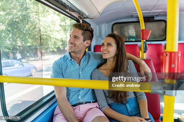 couple riding the bus - london bus stock pictures, royalty-free photos & images