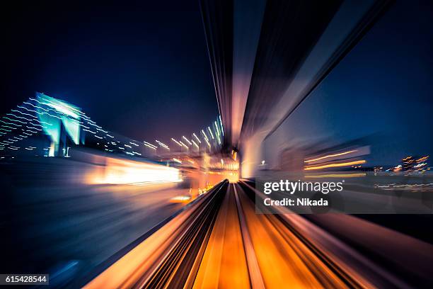 abstract motion-blurred view from a moving train - electric stockfoto's en -beelden