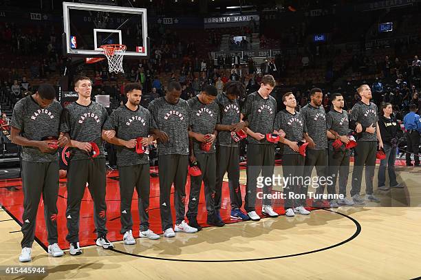 The Toronto Raptors honor The National Anthem before a preseason game against the San Lorenzo de Almagro on October 14, 2016 at the Air Canada Centre...