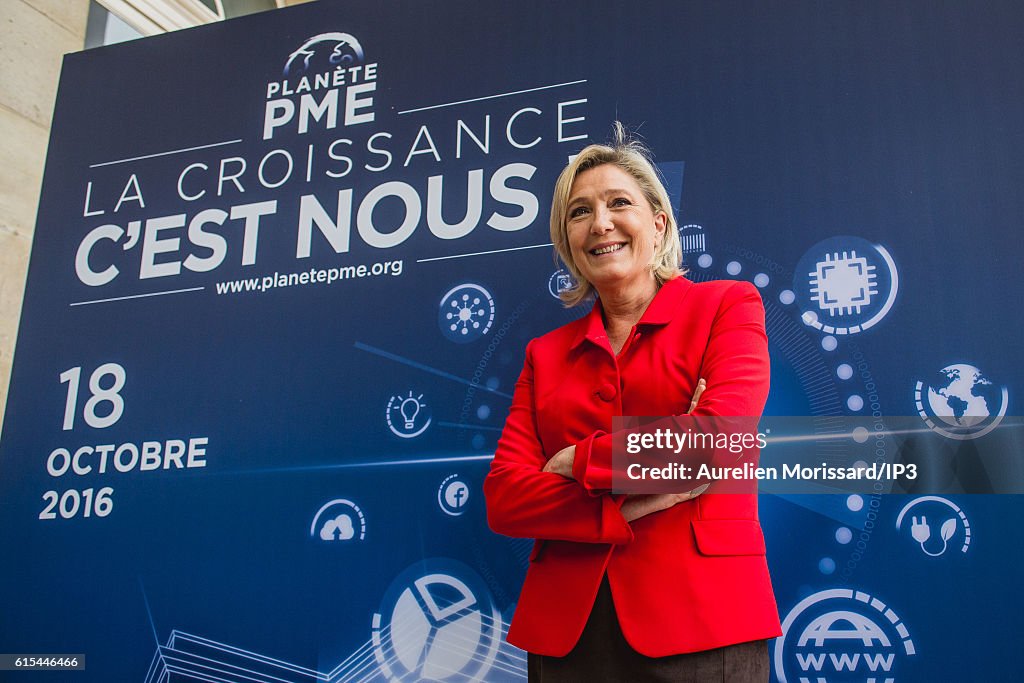 Marine Le Pen Visits "Planet PME"  in Paris