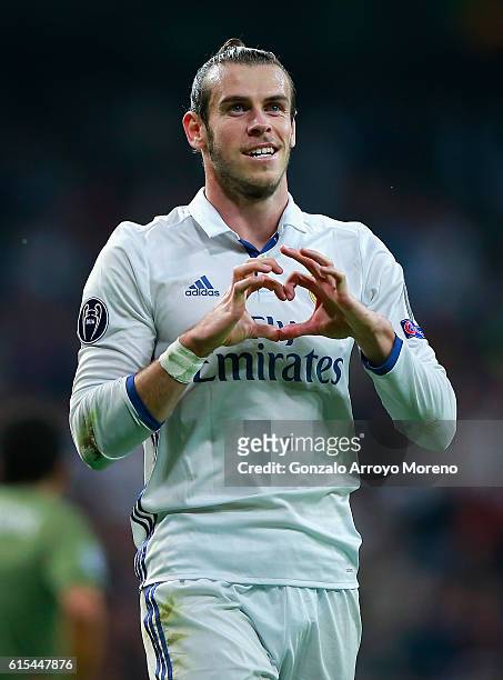 Gareth Bale of Real Madrid celebrates scoring his team's first goal during the UEFA Champions League Group F match between Real Madrid CF and Legia...