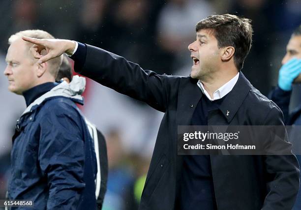 Mauricio Pochettino, head coach of Tottenham battle for the ball during the UEFA Champions League group E match between Bayer 04 Leverkusen and...