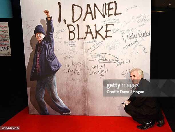 John McDonnell signs his name while attending the "I, Daniel Blake" People's Premiere at Vue West End on October 18, 2016 in London, England.