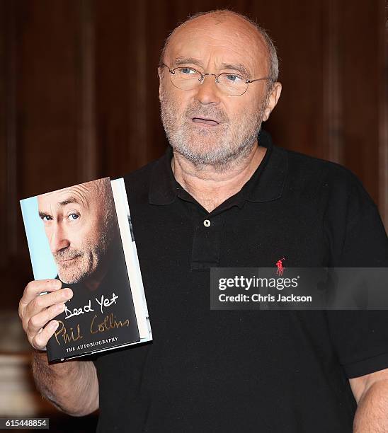 To celebrate the launch of his autobiography Not Dead Yet, Phil Collins poses ahead of a talk at St James Church on October 18, 2016 in London,...