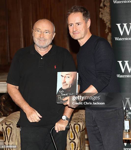 To celebrate the launch of his autobiography Not Dead Yet, Phil Collins poses with Magic FMs Richard ahead of a talk at St James Church on October...