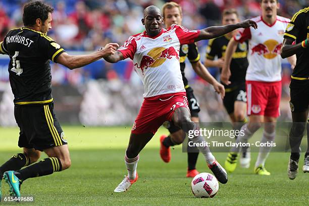 Bradley Wright-Phillips of New York Red Bulls is challenged by Michael Parkhurst of Columbus Crew in action during the New York Red Bulls Vs Columbus...