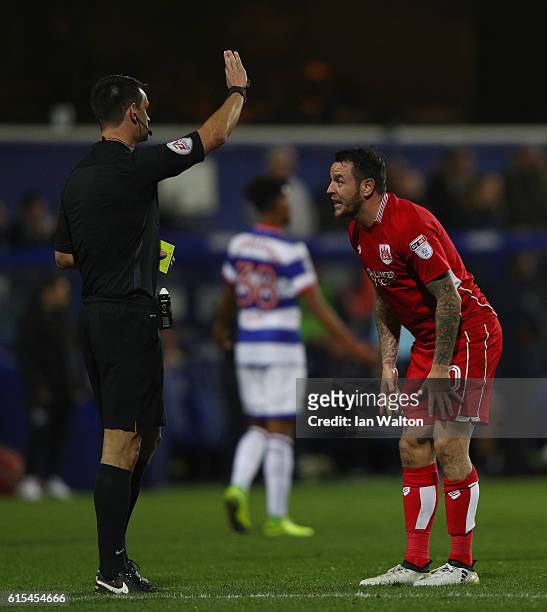 Lee Tomlin of Bristol City is showen a yellow card during the Sky Bet Championship match between Queens Park Rangers and Bristol City at Loftus Road...
