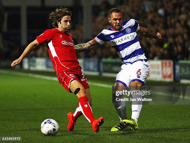 Adam Matthews of Bristol City tries to tackle Joel Lynch of Queens Park Rangers during the Sky Bet Championship match between Queens Park Rangers and...