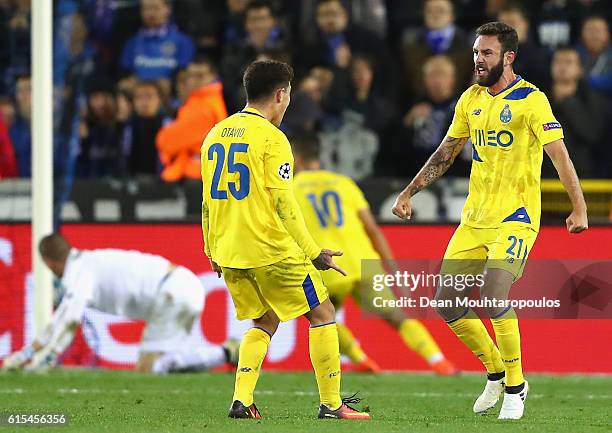 Miguel Layun of FC Porto celebrates scoring his team's first goal with his team mate Otavio during the UEFA Champions League Group G match between...