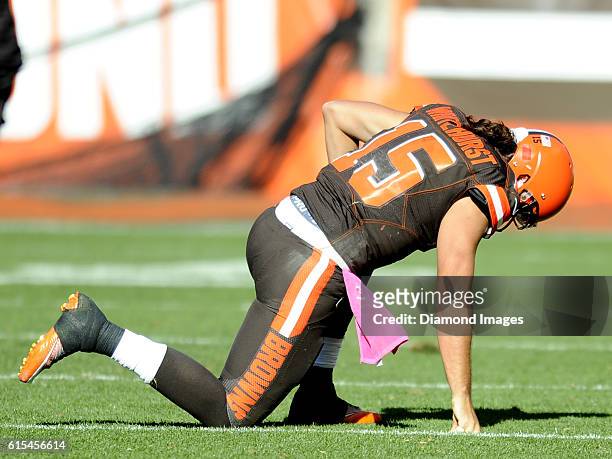 Quarterback Charlie Whitehurst of the Cleveland Browns kneels on the field after being injured during a game against the New England Patriots on...