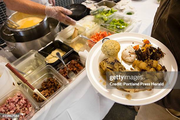 Gourmet omelettes are prepared during a brunch at SMCC to benefit the family of 2010 SMCC culinary graduate Adrian's "Mike" Kusama, on Sunday,...