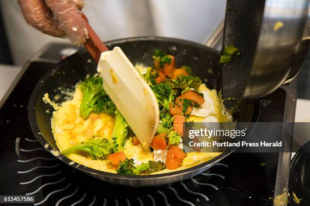 Gourmet omelettes are prepared during a brunch at SMCC to benefit the family of 2010 SMCC culinary graduate Adrian's "Mike" Kusama, on Sunday,...