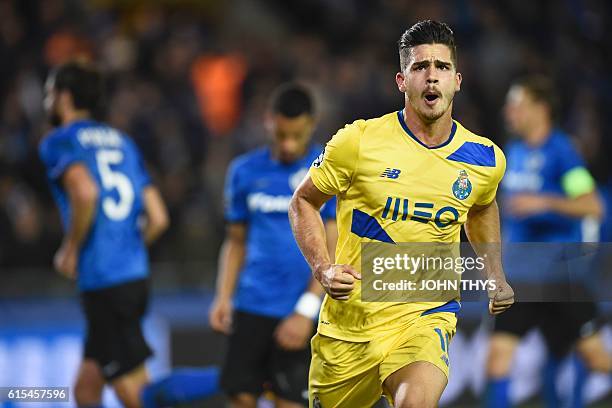 Porto's forward Andre Silva celebrates after scoring a last minute penalty kick during the UEFA Champions League groug G football match Club Brugge...