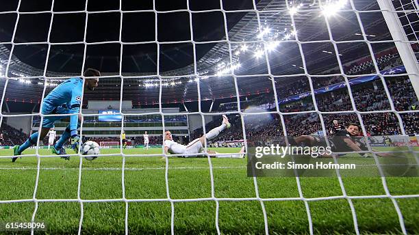 Chicharito of Leverkusen scores a disallowed goal against goalkeeper Hugo Lloris of Tottenham during the UEFA Champions League match between Bayer 04...