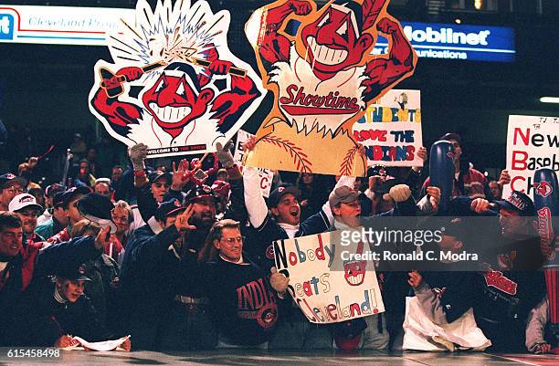 World Series: View of fans in stands holding Cleveland Indians muscled Chief Wahoo logos during game vs Atlanta Braves at Jacobs Field. Game 3....