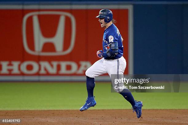 Josh Donaldson of the Toronto Blue Jays celebrates after hitting a solo home run in the third inning against Corey Kluber of the Cleveland Indians...