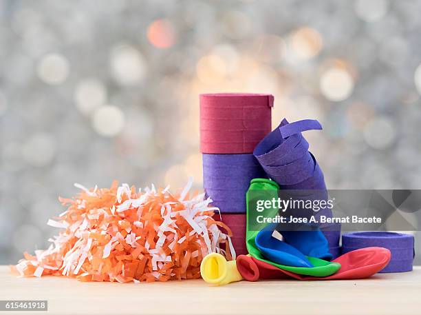 rolls of streamers, confetti and balloons of colors to celebrate a holiday - luftschlange stock-fotos und bilder