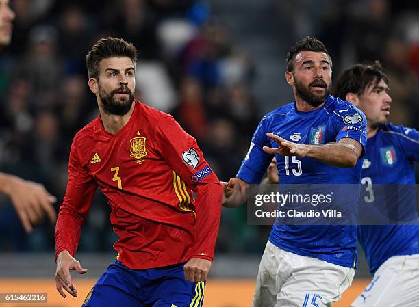 Andrea Barzagli of Italy and Gerard Pique of Spain compete during the FIFA 2018 World Cup Qualifier between Italy and Spain at Juventus Stadium on...