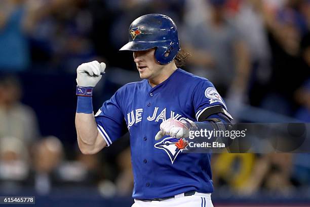 Josh Donaldson of the Toronto Blue Jays runs home after hitting a solo home run in the third inning against Corey Kluber of the Cleveland Indians...