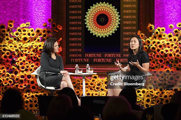 Priscilla Chan, co-founder of the Chan Zuckerberg Initiative LLC, right, speaks as Sheryl Sandberg, chief operating officer of Facebook Inc., listens...