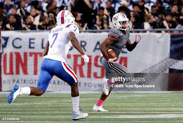 UMass running back Marquis Young tries to get past Louisiana Tech Bulldogs safety Xavier Woods . The Louisiana Tech Bulldogs defeated the UMass...