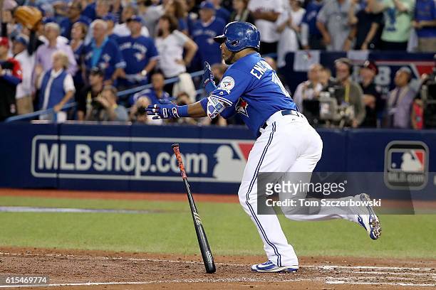 Edwin Encarnacion of the Toronto Blue Jays hits an RBI double scoring Ryan Goins and Jose Bautista in the seventh inning against Bryan Shaw of the...