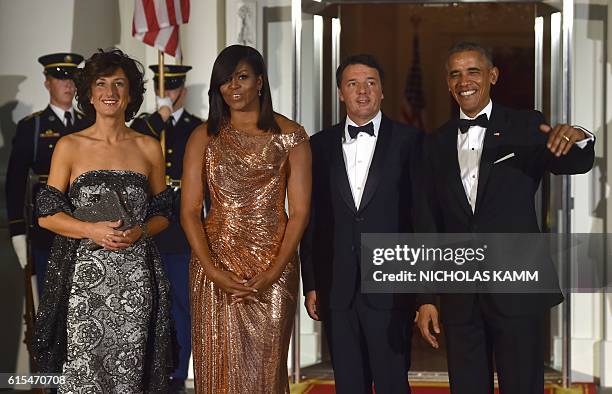 President Barack Obama and First Lady Michelle Obama welcome Italian Prime Minister Matteo Renzi and his wife Agnese Landini on the Noth Portico of...