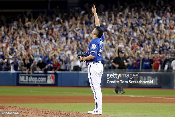 Roberto Osuna of the Toronto Blue Jays celebrates in the ninth inning against the Cleveland Indians during game four of the American League...