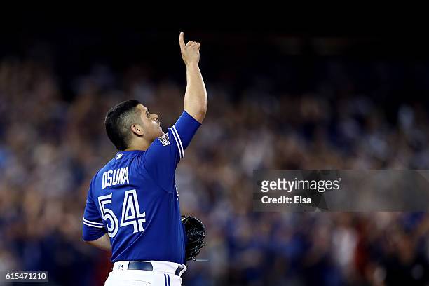 Roberto Osuna of the Toronto Blue Jays celebrates after defeating the Cleveland Indians with a score of 5-1 in game four of the American League...