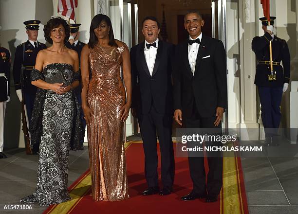 President Barack Obama and First Lady Michelle Obama welcome Italian Prime Minister Matteo Renzi and his wife Agnese Landini on the North Portico of...