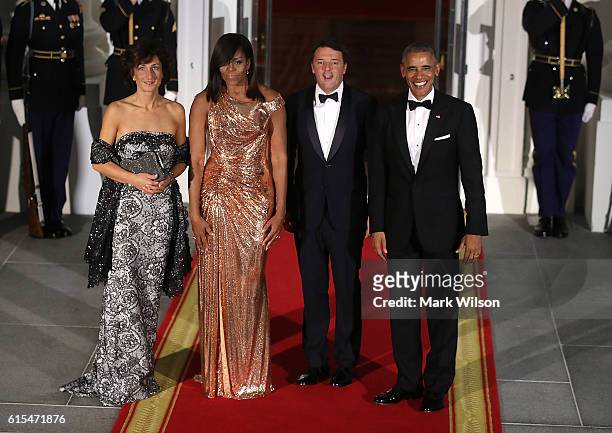President Barack Obama and first lady Michelle Obama stand with Italian Prime Minister Matteo Renzi and his wife Mrs. Agnese Landini upon arrival for...
