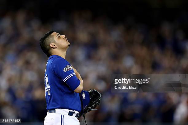 Roberto Osuna of the Toronto Blue Jays celebrates the final out of the ninth inning to defeat the Cleveland Indians with a score of 5 to 1 in game...