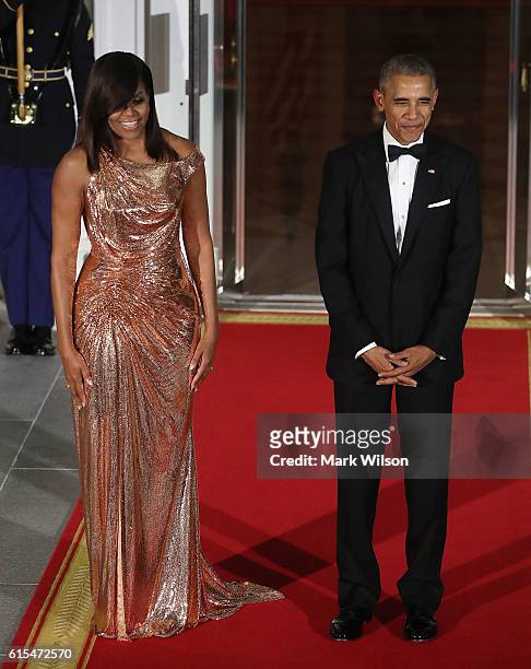President Barack Obama and first lady Michelle Obama wait for the arrival of Italian Prime Minister Matteo Renzi and his wife Mrs. Agnese Landini,...