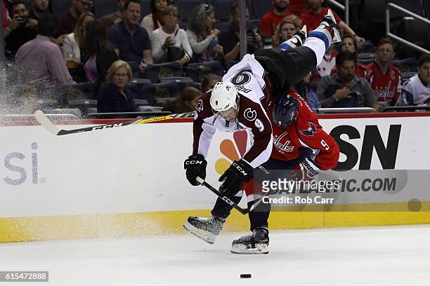 Matt Duchene of the Colorado Avalanche flips over Dmitry Orlov of the Washington Capitals in the first period at Verizon Center on October 18, 2016...