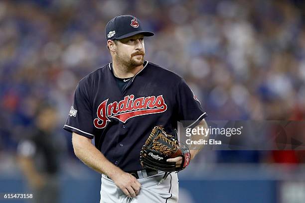 Bryan Shaw of the Cleveland Indians walks back to the dugout after being relieved in the seventh inning against the Toronto Blue Jays during game...