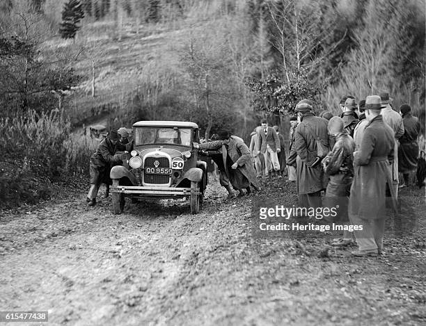 Seaton's Ford Model A saloon receiving a push in the Inter-Varsity Trial, 1930. Ford A Saloon Vehicle Reg. No. QQ9550. Event Entry No: 50 Driver:...