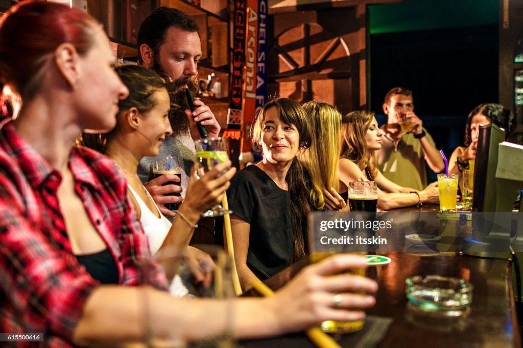 Friends partying in the bar