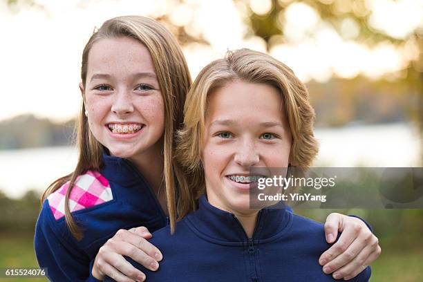 head and shoulder portrait of young boy and girl sibling - brother stock pictures, royalty-free photos & images