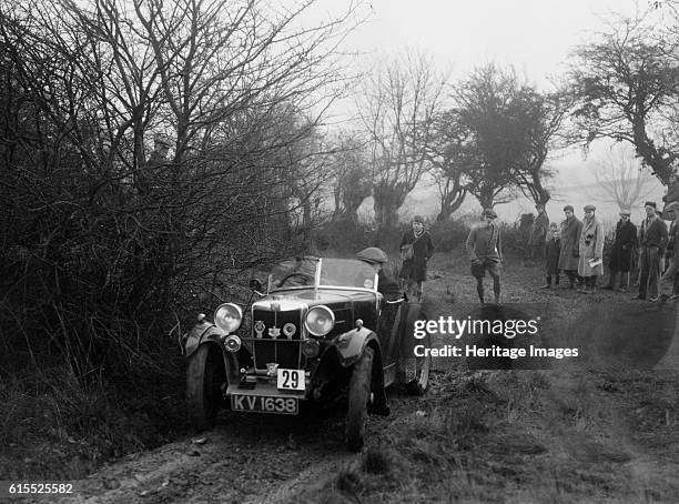 Type of AJ Milburn at the Sunbac Colmore Trial, near Winchcombe, Gloucestershire, 1934. MG M 847 cc. Vehicle Reg. No. KV1638. Event Entry No: 29...