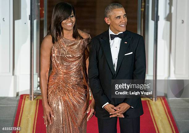President Barack Obama and First Lady Michelle Obama await the arrival of Italian Prime Minister Matteo Renzi and Agnese Landini on October 18, 2016...