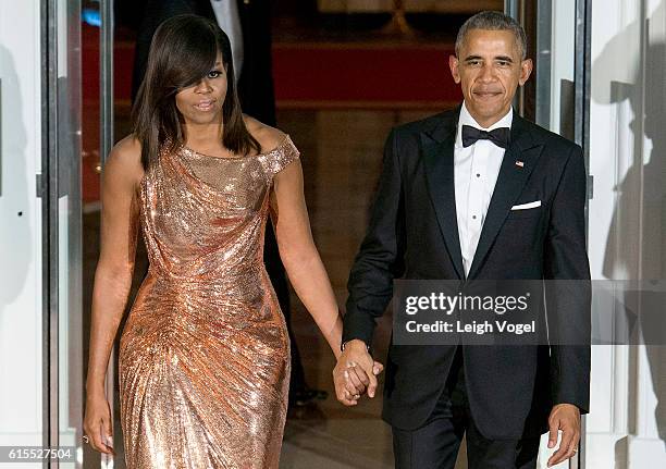 President Barack Obama and First Lady Michelle Obama await the arrival of Italian Prime Minister Matteo Renzi and Agnese Landini on October 18, 2016...