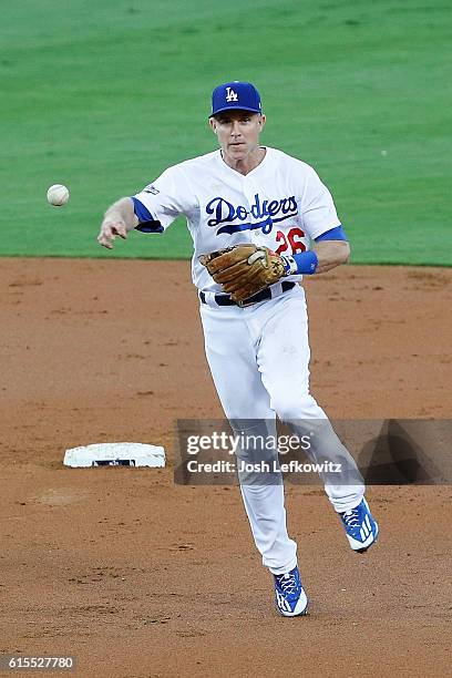 Chase Utley of the Los Angeles Dodgers throws out a runner against the Chicago Cubs in the second inning of game three of the National League...
