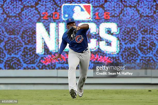 Jorge Soler of the Chicago Cubs catches a ball hit by Adrian Gonzalez of the Los Angeles Dodgers in the first inning in game three of the National...