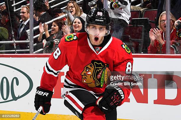 Patrick Kane of the Chicago Blackhawks reacts after scoring against the Philadelphia Flyers in the first period at the United Center on October 18,...