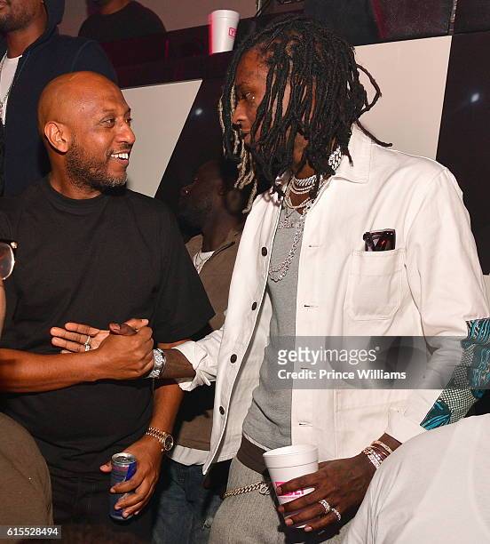 Alex Gidewon and Young Thug attend Gucci Mane 'Woptober' Album Release Party at Gold Room on October 18, 2016 in Atlanta, Georgia.