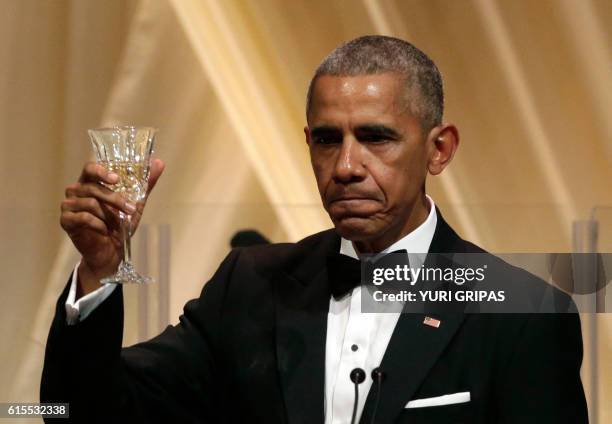 President Barack Obama delivers a toast during the State Dinner with Italian Prime Minister Matteo Renzi at the White House in Washington on October...